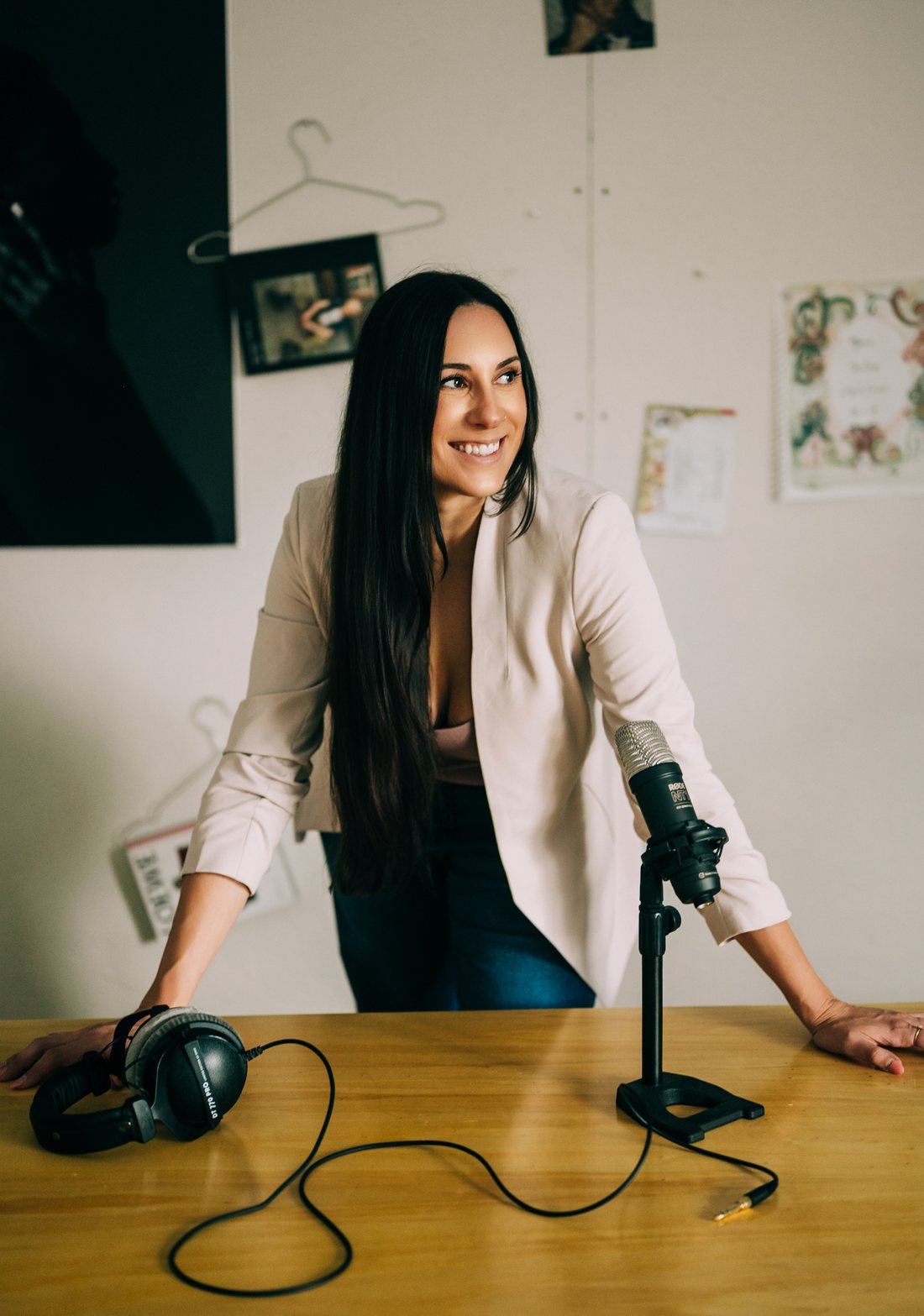Portrait of narrator Lauren Beck at her studio microphone